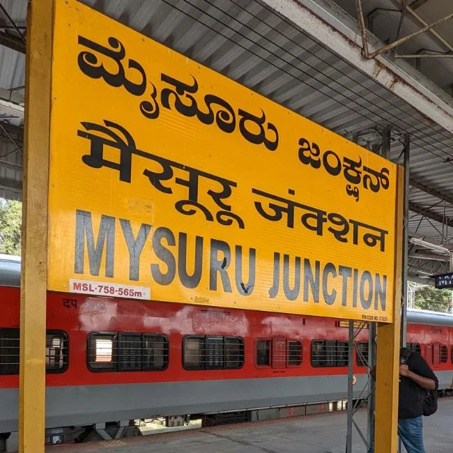 Cab waiting outside Mysore Railway Station for Coorg transfer